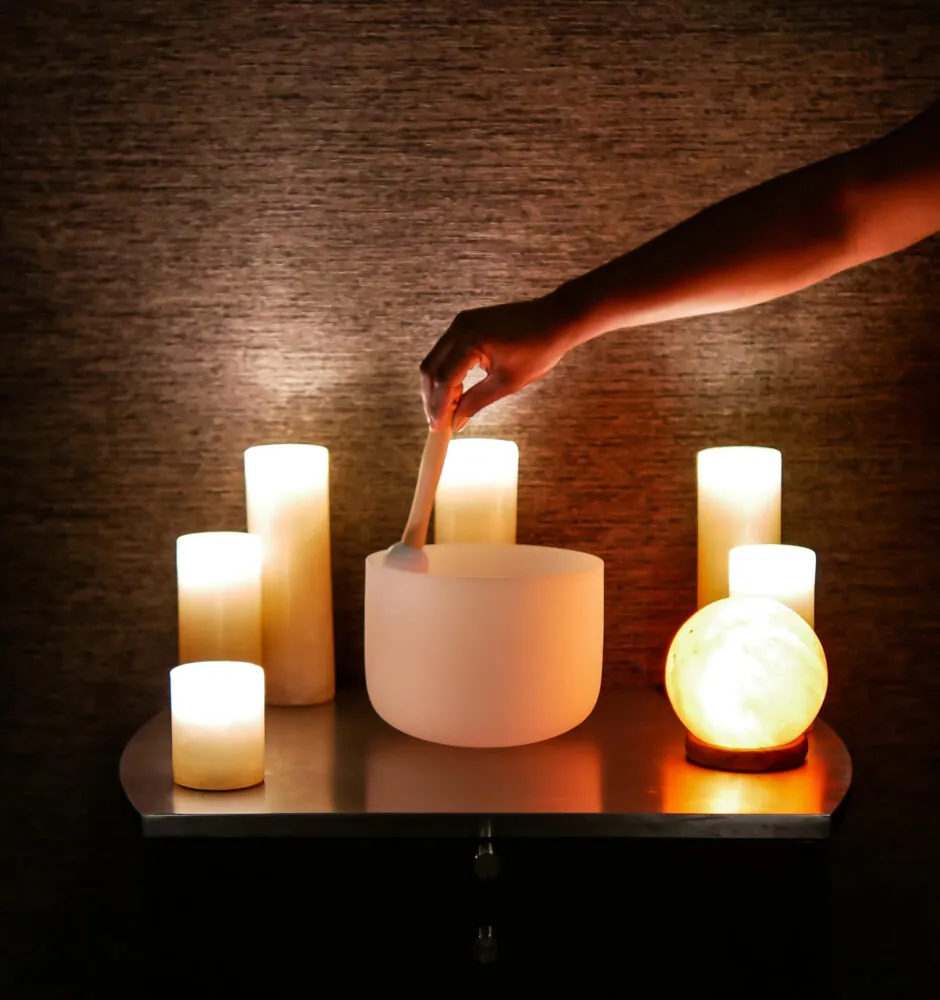 Hand lighting candles in spa room