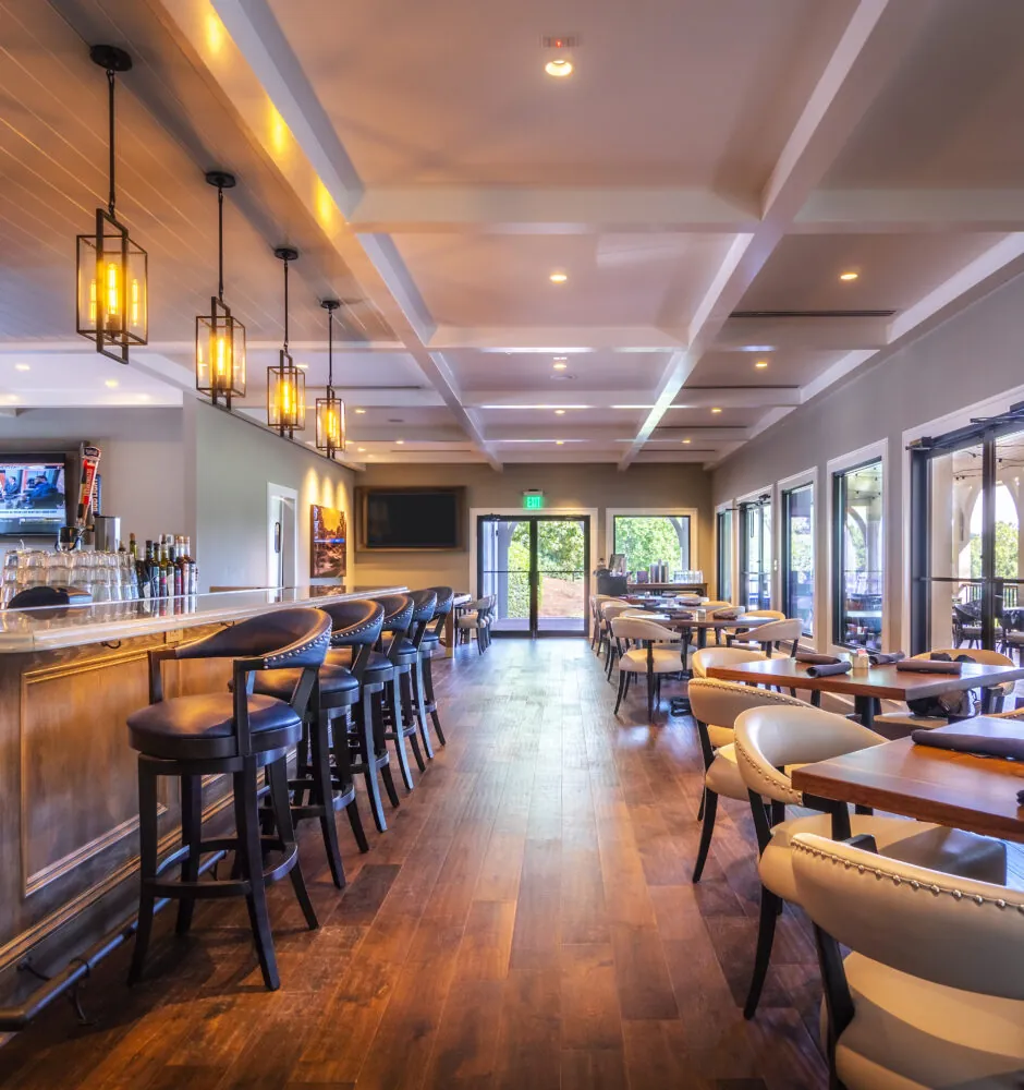 A bar and dining area inside a restaurant.
