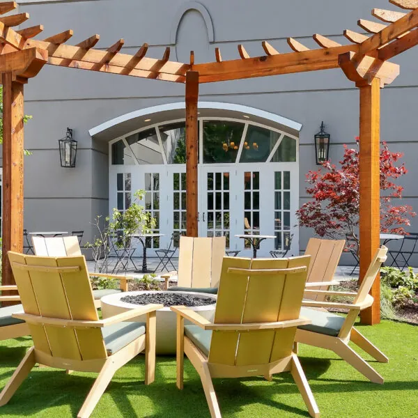 Outdoor seating area under wooden pergola