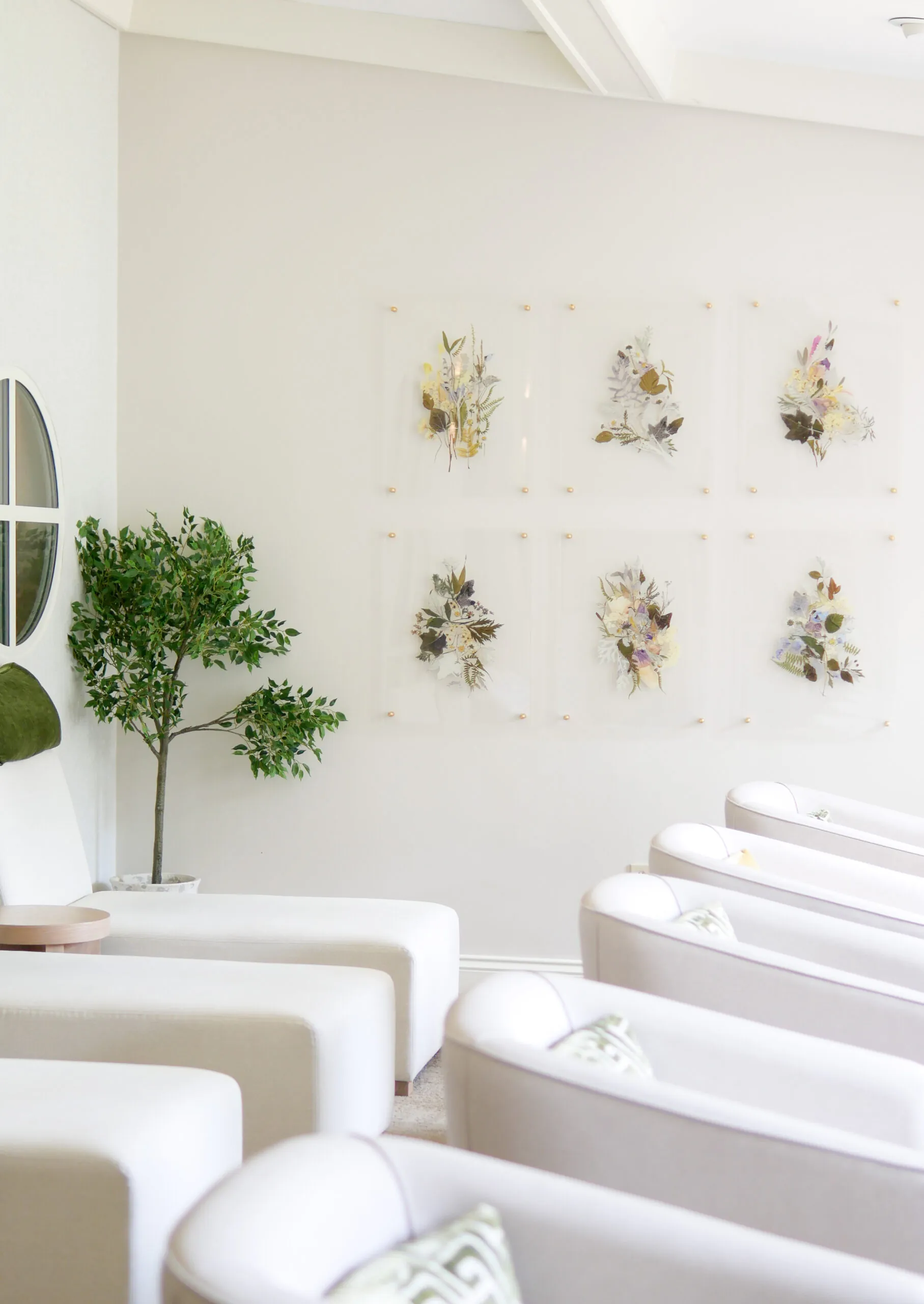 White lounge chairs in bright spa relaxation room